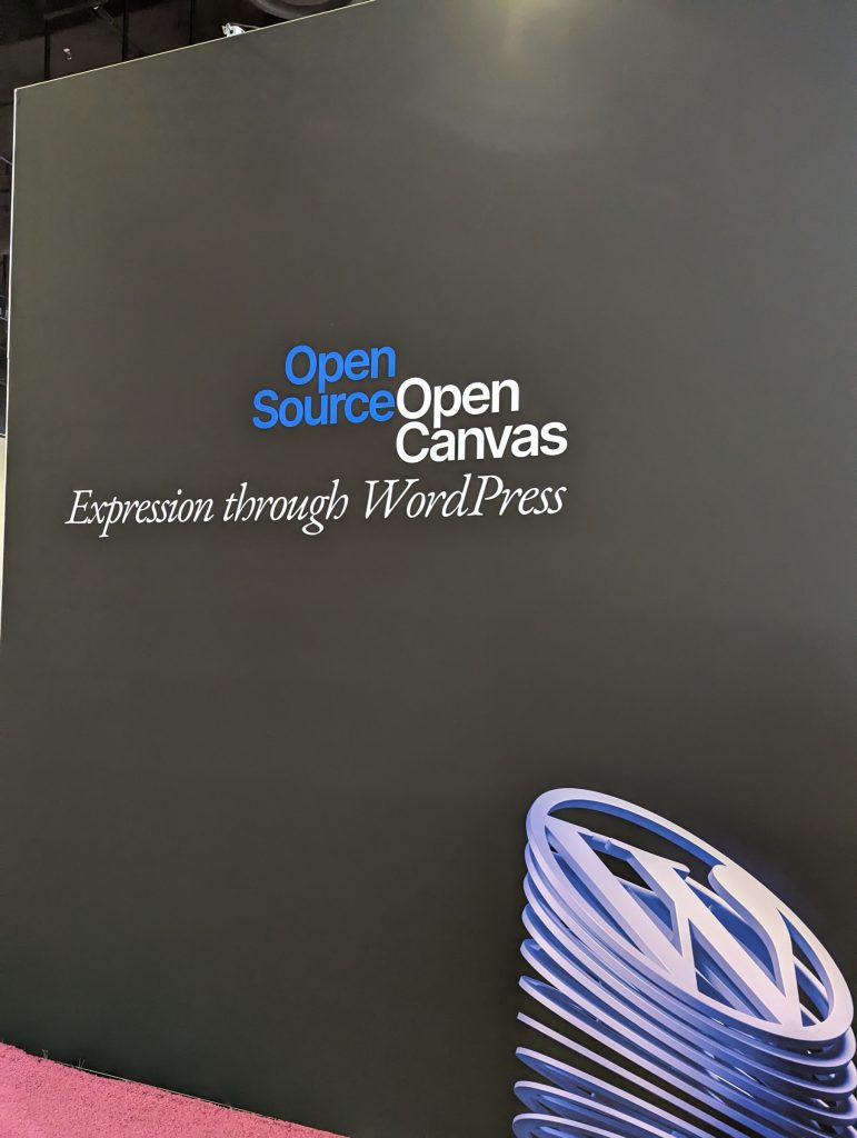 The outside gallery wall in WCUS's sponsor hall, which says "Open Source Open Canvas, Expression through WordPress".