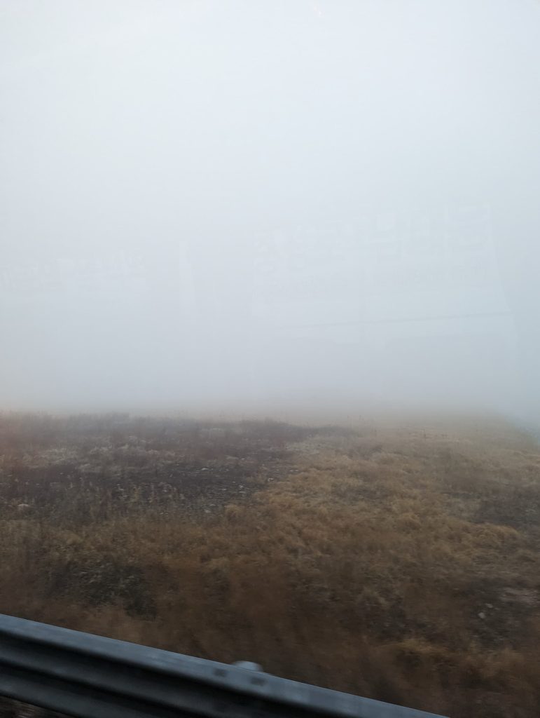 Landscape shot, but two-thirds of the photo is obscured by fog.