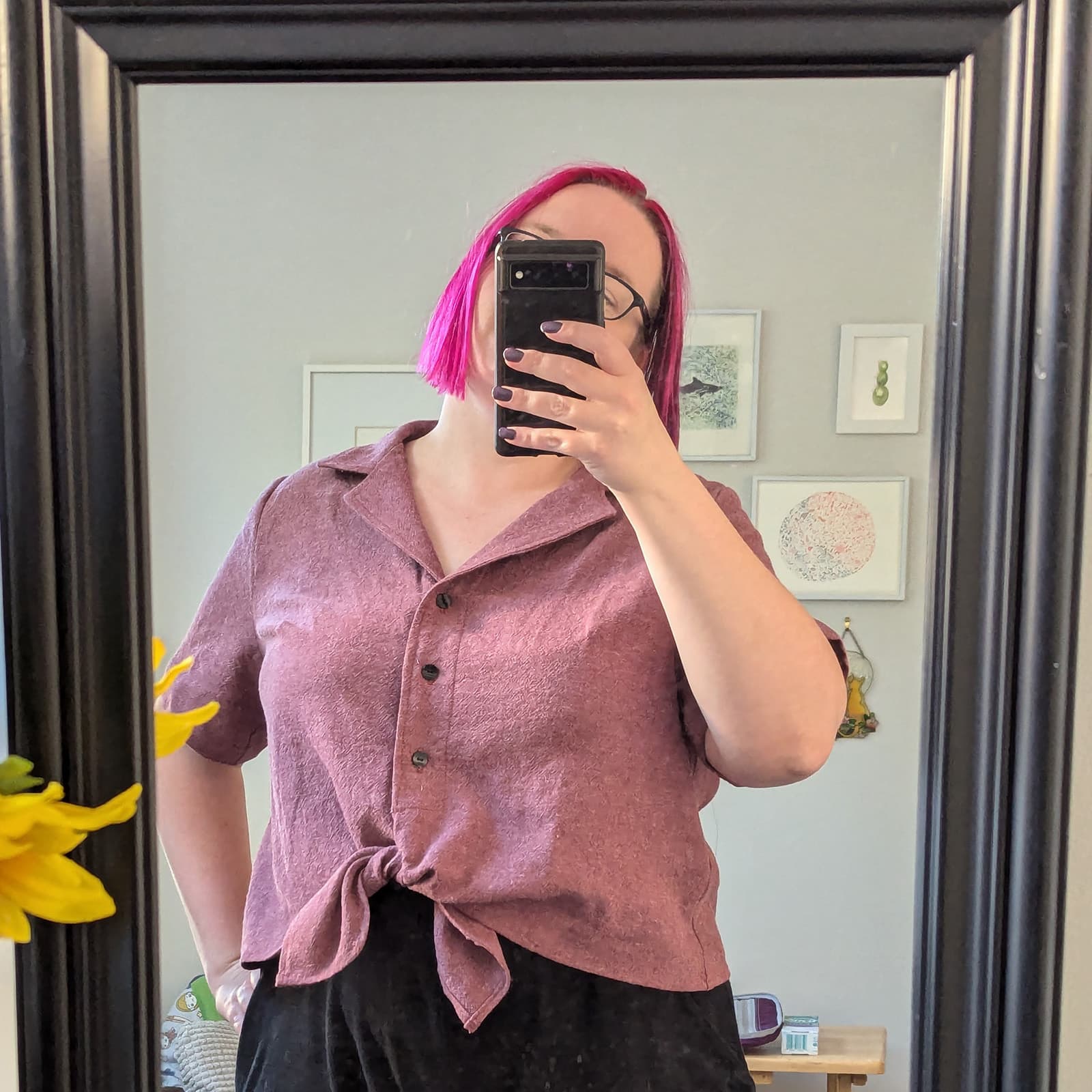 Mirror selfie of me with a dusty pink button up top, cropped and tied at the bottom.